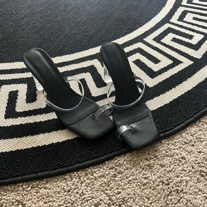 Clear and black heels